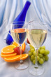 Two glasses of wine with oranges and grapes Two glasses of wine with oranges and grapes