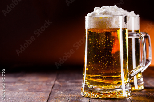 Photo: Beer on wooden table Beer on wooden table