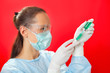 Young woman doctor preparing injection with ampoule and syringe Young woman doctor preparing injection with ampoule and syringe