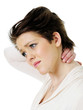 Young woman in pain holding her neck isolated on white
