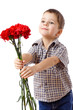 Smiling boy stretches forward a bouquet