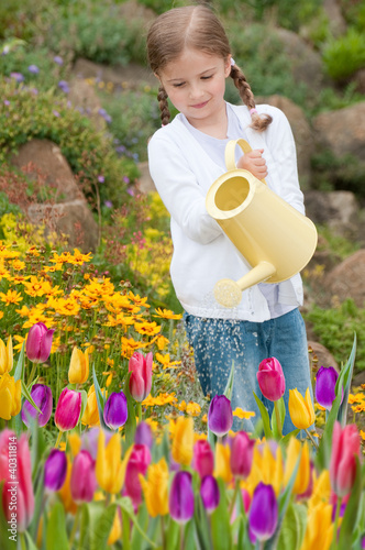 Photo: Little gardener watering flowers Little gardener watering flowers