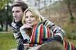 Photo: Young man embracing young woman Young man embracing young woman