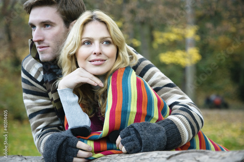 Photo: Young man embracing young woman Young man embracing young woman