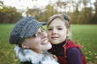 Mother with daughter, smiling, portrait