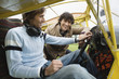Friends sitting in airplane