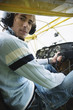 Young man sitting in airplane