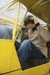 Young man sitting in airplane