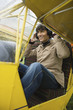Young man sitting in airplane