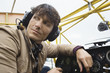 Young man sitting in airplane