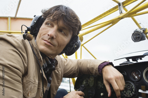 Photo: Young man sitting in airplane Young man sitting in airplane