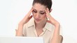 Woman with the hands on her forehead
