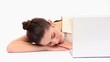 Woman resting on a table with a laptop