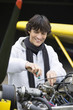 Young man screwing in airplane engine