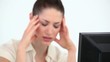 Woman holding her head in her hands