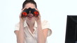 Young woman looking through binoculars