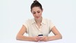 Young woman texting at a desk
