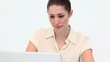 Depressed young woman using a laptop