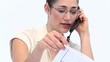 Businesswoman with statistics on the phone