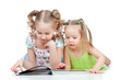 two sisters reading a book together