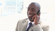 Smiling businessman phoning