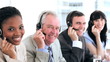 Happy business people working with headsets
