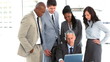 Serious business team surrounding their manager