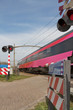 Foto: Fast train at level crossing Fast train at level crossing