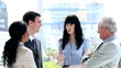 Business people standing white talking together