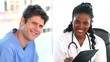Smiling practitioners talking together