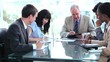 Smiling business team working while writing