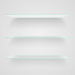 Glass shelves on light grey background