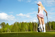 Young blonde  woman with golf equipment