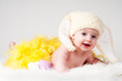 baby girl with yellow feather and Easter bunny ears baby girl with yellow feather and Easter bunny ears