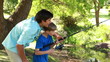 Video: Cheerful man fishing with his son Cheerful man fishing with his son