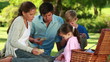 Happy family eating their sandwiches