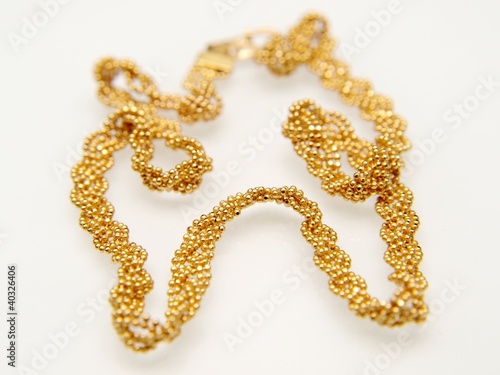 Photo: Yellow gold jewellry, isolated towards white background Yellow gold jewellry, isolated towards white background