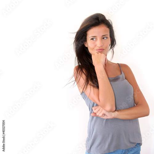 Photo: Charming young woman standing on white background, isolated Charming young woman standing on white background, isolated