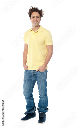 Photo: Full length image of a casual young man Full length image of a casual young man
