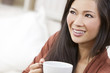 Photo: Beautiful Chinese Oriental Asian Woman Drinking Tea or Coffee Beautiful Chinese Oriental Asian Woman Drinking Tea or Coffee