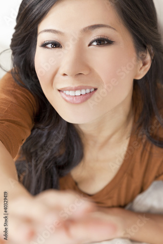 Photo: Beautiful Young Asian Chinese Woman Reaching To Camera Beautiful Young Asian Chinese Woman Reaching To Camera