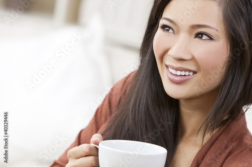 Photo: Beautiful Chinese Oriental Asian Woman Drinking Tea or Coffee Beautiful Chinese Oriental Asian Woman Drinking Tea or Coffee