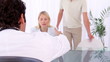 Video: Couple coming and giving a handshake to a doctor Couple coming and giving a handshake to a doctor