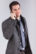 Portrait of a young caucasian business man using a mobile phone