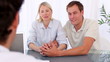 Video: Smiling couple talking with their doctor Smiling couple talking with their doctor
