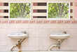 Photo of Old sinks in a public toilets