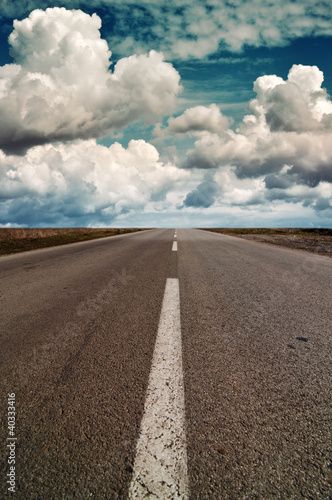Photo: Clouds above a highway Clouds above a highway