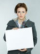 Foto: Sad woman with white message board Sad woman with white message board