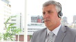 Serious businessman talking on a headset