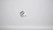 Video: One white dice in super slow motion rebonding on the grey floor One white dice in super slow motion rebonding on the grey floor